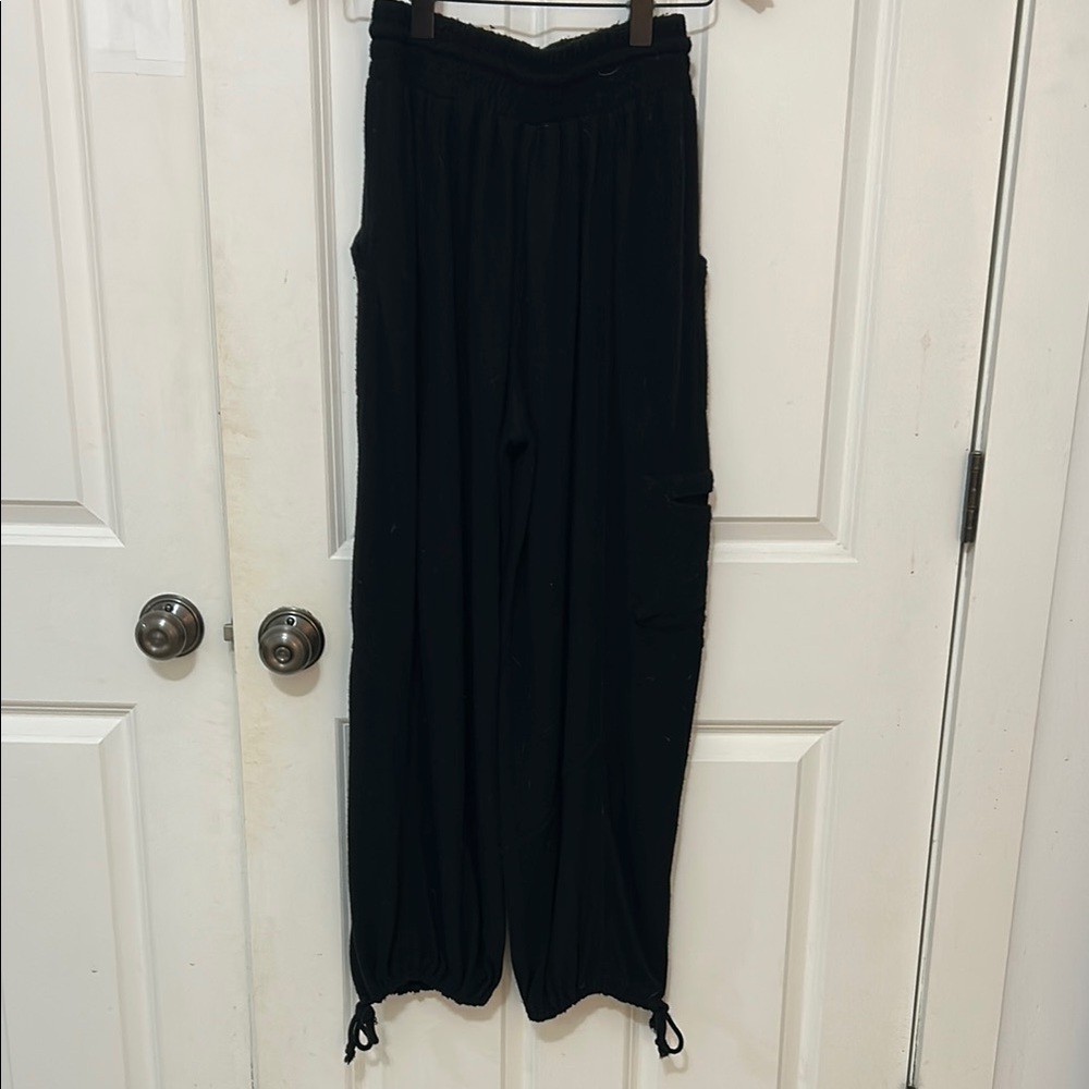 Out from under black elastic waist pants size XS side pocket tie bottom